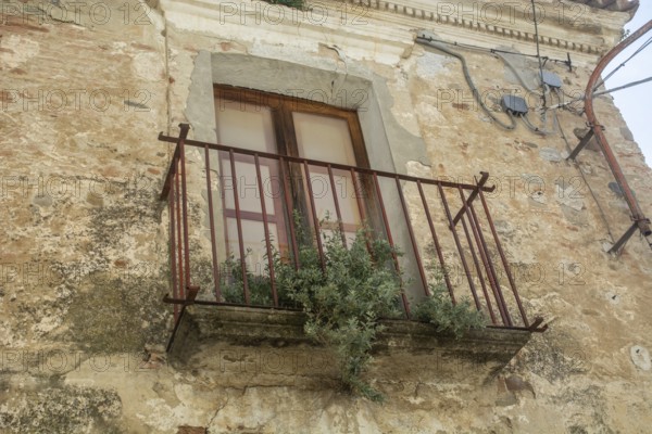 Balcony on an old house in Aliano, the very poor village in southern Italy that the writer Carlo Levi described in his book Christ stopped at Eboli. The book became a bestseller and was filmed. Aliano, Matera District, Basilicata, Italy, Southern Europe, Europe