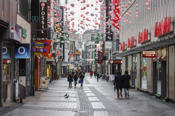 Cologne, North Rhine-Westphalia, Germany - Cologne city centre in times of the corona crisis during the second lockdown, the shops are closed, only a few passers-by stroll along Hohe Straße on Friday afternoon