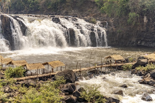 Wooden bridge at the Tad Lo waterfall in the Bolaven Plateau, Laos, Asia