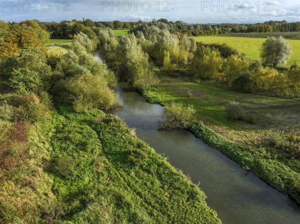 Bergkamen, Ruhr area, North Rhine-Westphalia, Germany, autumn landscape on the Seseke. The renaturalised Seseke, a tributary of the Lippe, has been transformed into a near-natural watercourse, flood protection and biodiversity through newly designed floodplains. Following the construction of a parallel sewer, the Seseke is now free of wastewater, having previously been an open, above-ground wastewater sewer, combined sewer with surface water and wastewater. Theme photo: EU Nature Conservation Act. The EU Nature Conservation Act obliges member states to implement measures to restore nature on at least 20 per cent of the EU's land and sea areas by 2030, Europe