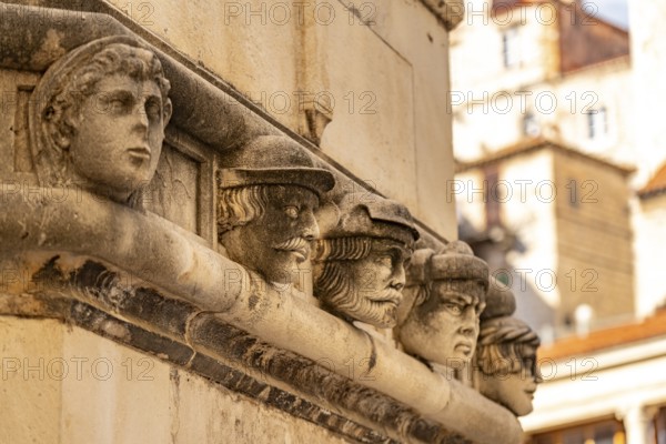 Famous heads on the façade of the Cathedral of St James, UNESCO World Heritage Site in Sibenik, Croatia, Europe