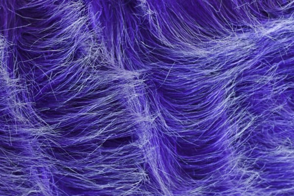 Close up of purple synthetic fake fur with white tips