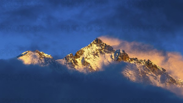 Snow-covered summit of the Weisshorn mountain, illuminated by the evening sun, view from Grimentz, Val d'Anniviers, Valais Alps, Canton Valais, Switzerland, Europe