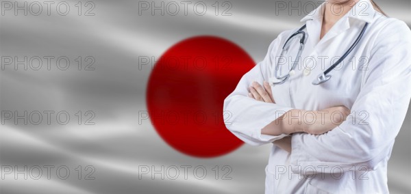 Doctor with crossed arms on Japan flag. Japan Health and Care concept. Female doctor on Japan flag