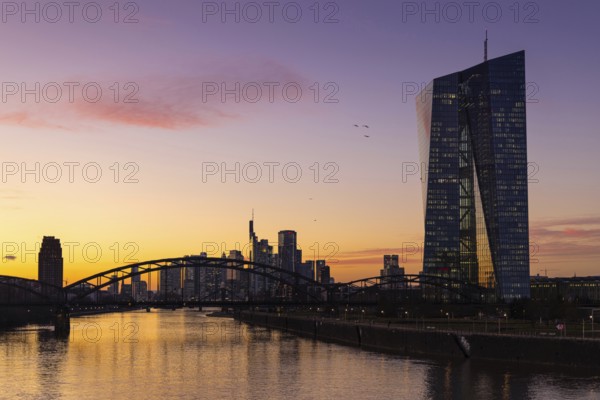 Shortly after sunset, the lights in the offices of the European Central Bank (ECB) and the Frankfurt banking skyline begin to glow, Frankfurt am Main, Osthafen, Hesse, Germany, Europe