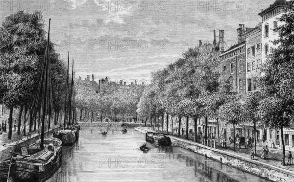 Tree-lined canal in the Dutch capital Amsterdam, cargo ships, promenade with pedestrians, buildings, geography, Kingdom of the Netherlands, historical illustration 1888