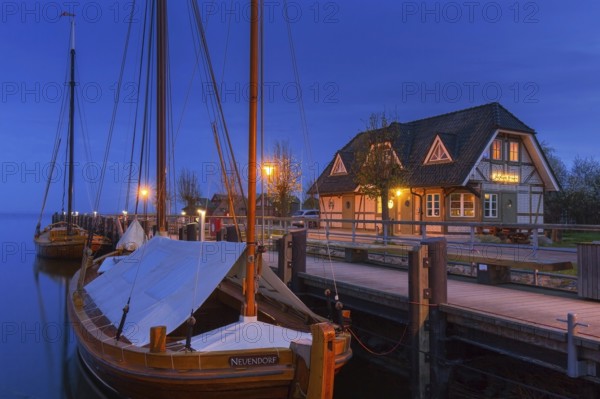 Fischland Brauerei, brewery and traditional sailing boats at dusk in the harbour of Althagen, Fischland-Darß-Zingst, Mecklenburg-Vorpommern, Germany, Europe