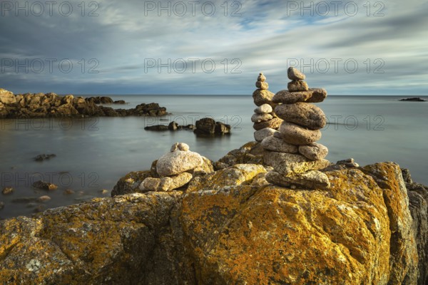 Rocky coast with cairns in the morning light, Allinge-Sandvig, Bornholm, Denmark, Europe