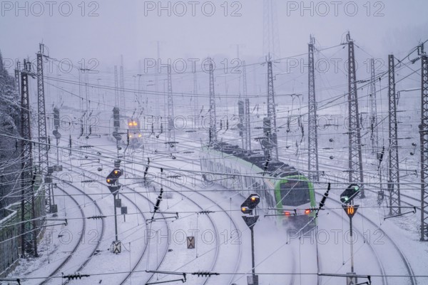 Winter weather, heavy snowfall, railway tracks in front of Essen main station, S-Bahn train, North Rhine-Westphalia, Germany, Europe