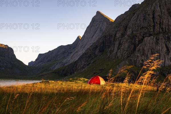Red tent on the beach at Horseid, Lofoten, Norway, Europe