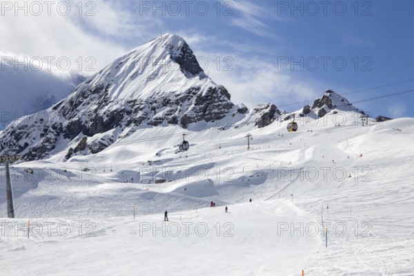 26 March 2024: Skiing against the backdrop of the Bernese Alps in Grindelwald, Switzerland. The mountain in the picture is the Tschuggen
