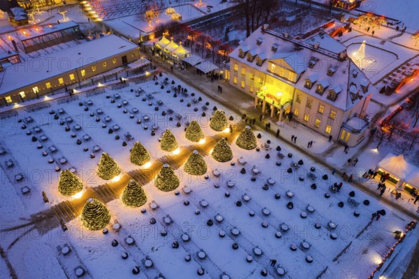 Aerial view of Wackerbarth Castle with castle park in snow and Christmas lights, Radebeul, Saxony, Germany, Europe