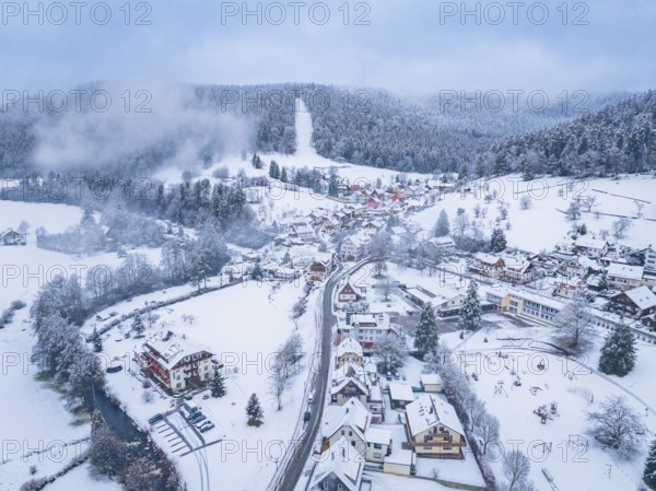 Rural winter landscape with snow-covered houses and hills, Enzklösterle, district of Calw, Black Forest, Germany, Europe