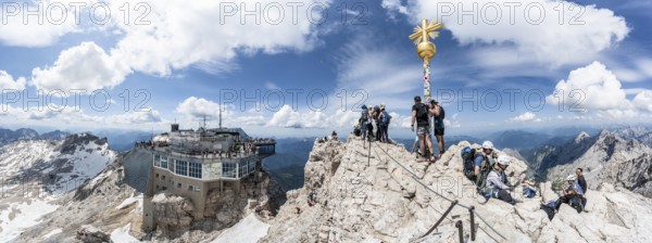 Panorama, view of the Zugspitzplatt, tourist summit of the Zugspitze with golden summit cross and modern mountain station of the Bavarian Zugspitze railway at the summit of the Zugspitze, Wetterstein range, Northern Limestone Alps, Bavaria, Germany, Europe