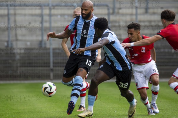 Football: Waldhof Mannheim against RWD Molenbeek Belgium in Mannheim (preparation match for the 2024/25 season) . Picture: Terrence Boyd (13) and Kennedy Okpala (32)