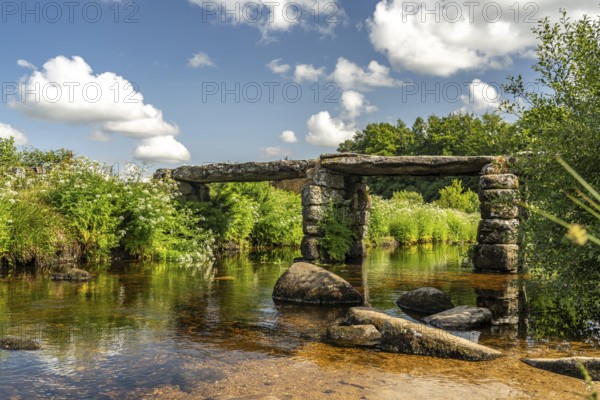 The medieval stone slab bridge Clapper Bridge in Postbridge, Dartmoor, Devon, England, Great Britain