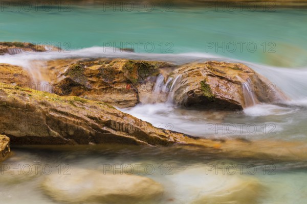 The Riss creek flowing through an autumnal landscape in the Eng valley