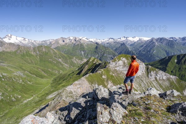 Mountaineer in front of mountain panorama with Großvenediger, mountain landscape with mountain peaks of the Venediger group, view from the summit of the Gösleswand, Lasörling group, Hohe Tauern National Park, East Tyrol, Tyrol, Austria, Europe