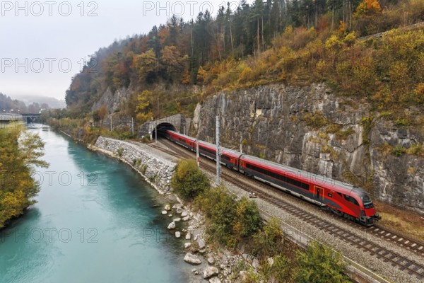 Railjet railway passenger train of the Austrian Federal Railways ÖBB on the Arlbergbahn in autumn in Feldkirch, Austria, Europe