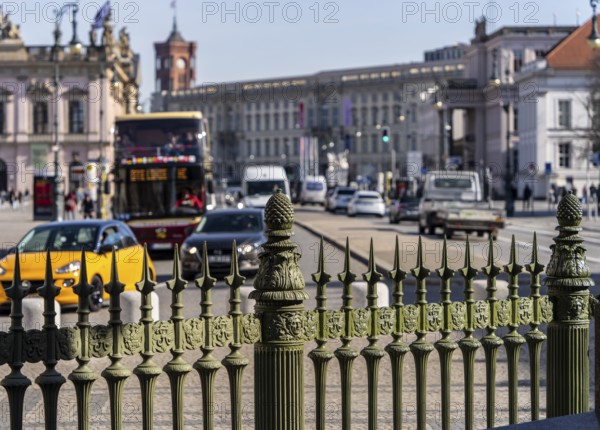 View over a historic fence towards the street Unter den Linden, Berlin