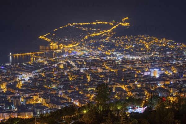 The lights of the city of Alanya on the Turkish Riviera glow in the evening, Alanya, Antalya, Turkey, Asia
