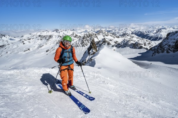 Ski tourer descending Piz Kesch on the Vadret da Porchabella glacier, view of mountain panorama in winter, Alpine tour, Ski tour Bündner Haute Route, Albula Alps, Rhaetian Alps, Grisons, Eastern Switzerland, Switzerland, Europe