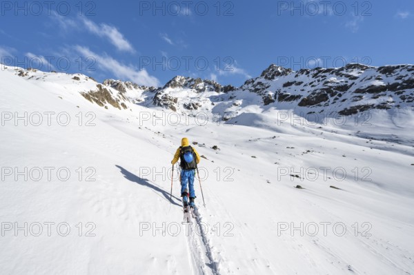 Ski tourers in a wintry mountain landscape, Bündner Haute Route ski tour, Albula Alps, Rhaetian Alps, Grisons, Eastern Switzerland, Switzerland, Europe