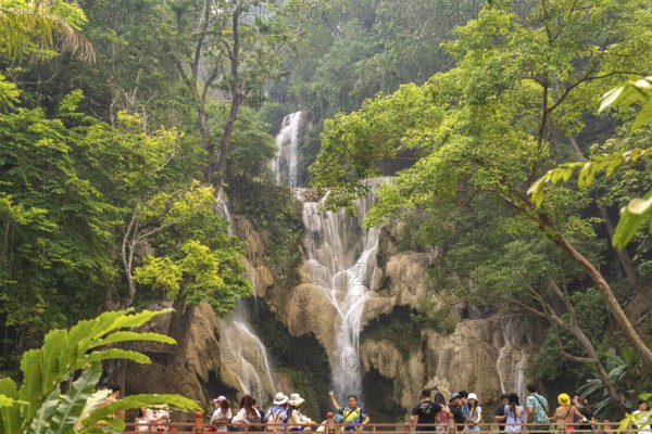 Tourists on the bridge at Kuang Si waterfall near Luang Prabang, Laos, Asia