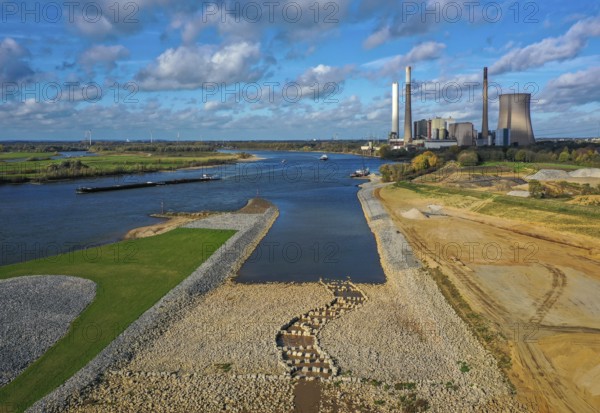 Dinslaken, Voerde, North Rhine-Westphalia, Germany, Inauguration of the new Emscher estuary into the Rhine. The decommissioned STEAG Voerde coal-fired power station is in the background. The mouth of the Emscher into the Rhine has been moved almost 500 metres north from Dinslaken to Voerde. Fish can now swim barrier-free up the new Emscher from the Rhine through a newly created floodplain area. Following the construction of a parallel sewer, the Emscher has been completely free of sewage since January 2022. The river was previously an open, above-ground combined sewer with rainwater and wastewater, Europe