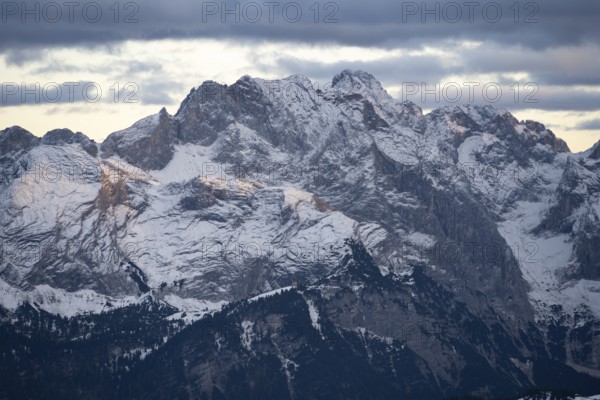 Wetterstein ridge with Partenkirchner Dreitorspitze, Meillerhütte and Schachenhaus, mountain peak with snow in autumn, Wetterstein mountains at sunset, view from Kramerspitz, Bavarian Prealps, Bavaria, Germany, Europe