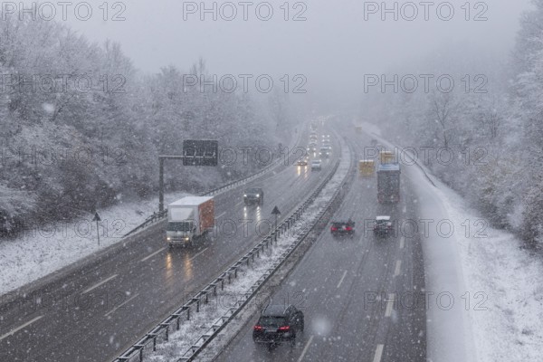 Thick blanket of snow covers the motorway with passing vehicles in winter, Winnenden, Baden-Württemberg, Germany, Europe
