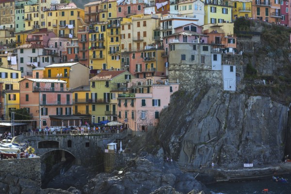 Colourful multi storied stucco cladded residentialapartment buildings in Manarola village, Cinque Terre, La Spezia, Italy, Europe