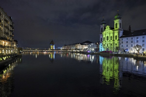 Water tower and Jesuit church on the right with light installation, on the Reuss at dusk, Old Town, Lilu, Light Festival 2025, Lucerne, Canton of Lucerne, Switzerland, Europe