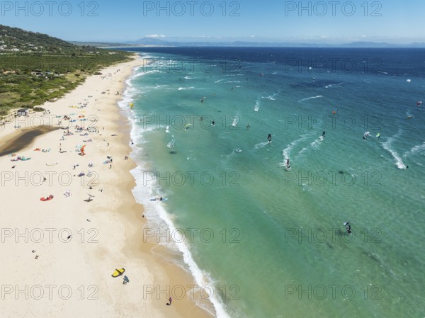 Kite surfers at the Valdevaqueros beach near Tarifa. In the distance the coastline of Morocco. Aerial view. Drone shot. Cádiz province, Andalusia, Spain, Europe