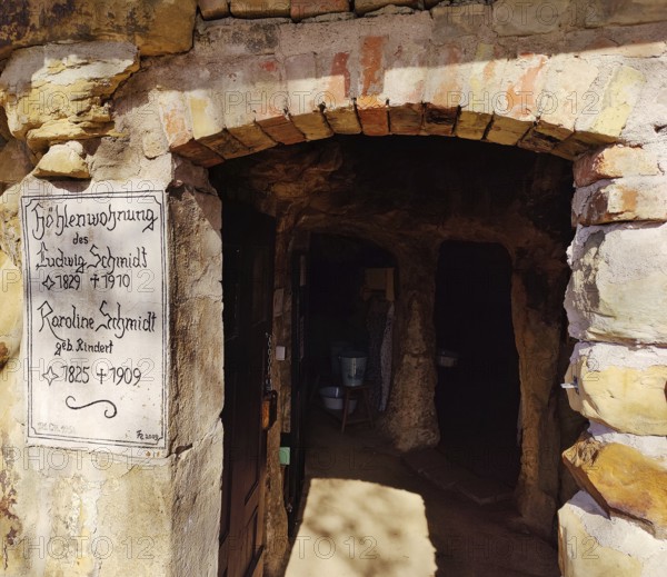 Sign at the entrance to the Schmidthöhle cave, Langenstein cave dwellings, district of Halberstadt, Harz district, Saxony-Anhalt, Germany, Europe