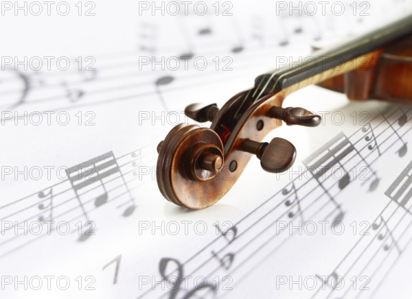 Detail view of a violin, sheet music, composing