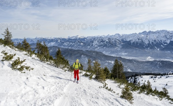 Ski tourers climbing Simetsberg, view of mountain panorama, Estergebirge, Bavarian Prealps, Bavaria Germany