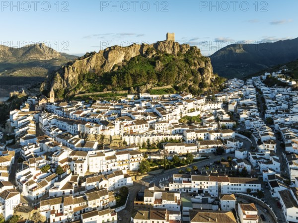 The White Town of Zahara de la Sierra below a Moorish castle. Aerial view. Drone shot. Cádiz province, Andalusia, Spain, Europe