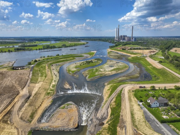 Dinslaken, Voerde, North Rhine-Westphalia, Germany, Renaturalisation of the Emscher. New Emscher estuary into the Rhine. Flood protection through land expansion. The decommissioned STEAG coal-fired power station in Voerde in the background. The mouth of the Emscher into the Rhine was moved from Dinslaken to Voerde, almost 500 metres to the north. Fish can now swim barrier-free up the new Emscher from the Rhine through a newly created floodplain area. Following the construction of a parallel sewer, the Emscher has been completely free of sewage since January 2022. The river was previously an open, above-ground combined sewer with rainwater and wastewater, Europe