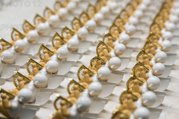 Angel figurines drying between different stages of painting, in the Wendt & Kühn world in Grünhainichen, Erzgebirge, Saxony, Germany, Europe