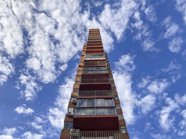 Strange very slender skyscraper against the cloudy sky, Buenos Aires, Argentina, South America