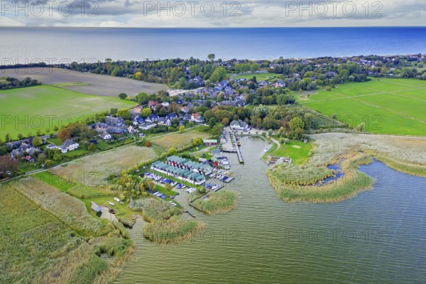 Aerial view over seaside resort Ahrenshoop and its marina on the Fischland-Darß-Zingst peninsula along the Baltic Sea, Mecklenburg-Vorpommern, Germany, Europe