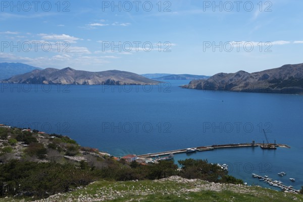 Panoramic view of a harbour on the calm blue sea, surrounded by mountains and islands, view from the church of St. Ivan, Baška, Baska, island of Krk, Kvarner Gulf Gulf Bay, Primorje-Gorski kotar, Croatia, Europe