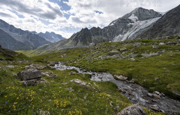 Mountain stream, mountain landscape with mountain peak Pigne d'Arolla and glacier Glacier de Tsijore Nouve, Valais, Western Alps Switzerland