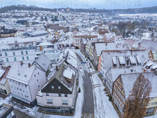 Bird's eye view of a snow-covered roofscape in a small town, Nagold, Black Forest, Germany, Europe