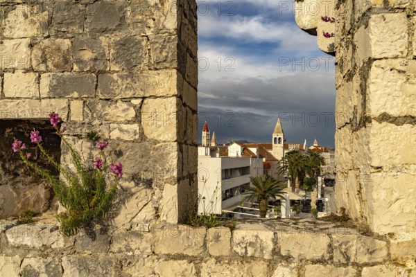 View through the battlements of Kamerlengo Fortress to the old town centre of Trogir, Croatia, Europe