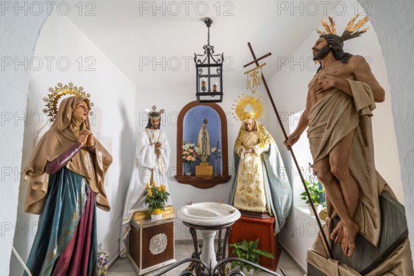 Figures of saints in the village church of Istan, Andalusia, Spain, Europe