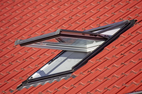 Close-up of a half-open skylight on a new building
