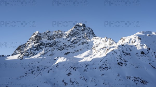 Mountain peak Piz Kesch with snow, view at the Kesch hut in winter, Grisons Haute Route, Albula Alps, Rhaetian Alps, Grisons, Eastern Switzerland, Switzerland, Europe