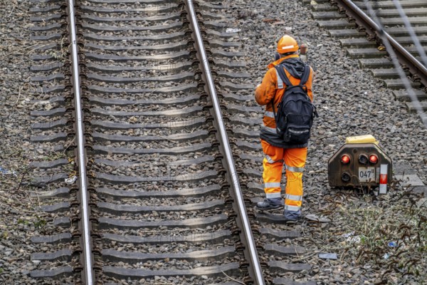 Worker on the railway tracks, after the end of his shift, walking home from the tracks, North Rhine-Westphalia, Germany, Europe